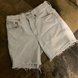 Light red tab button fly Blue Denim Women's Shorts. Raw hem.